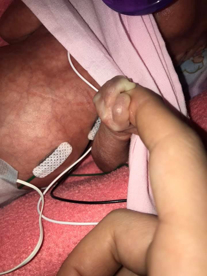 Keeleyjan9gripping momshand.jpg